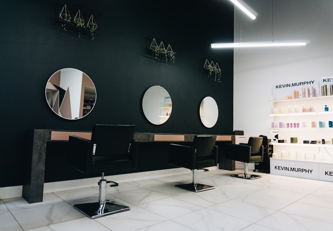 Modern hair salon interior with styling chairs and mirrors